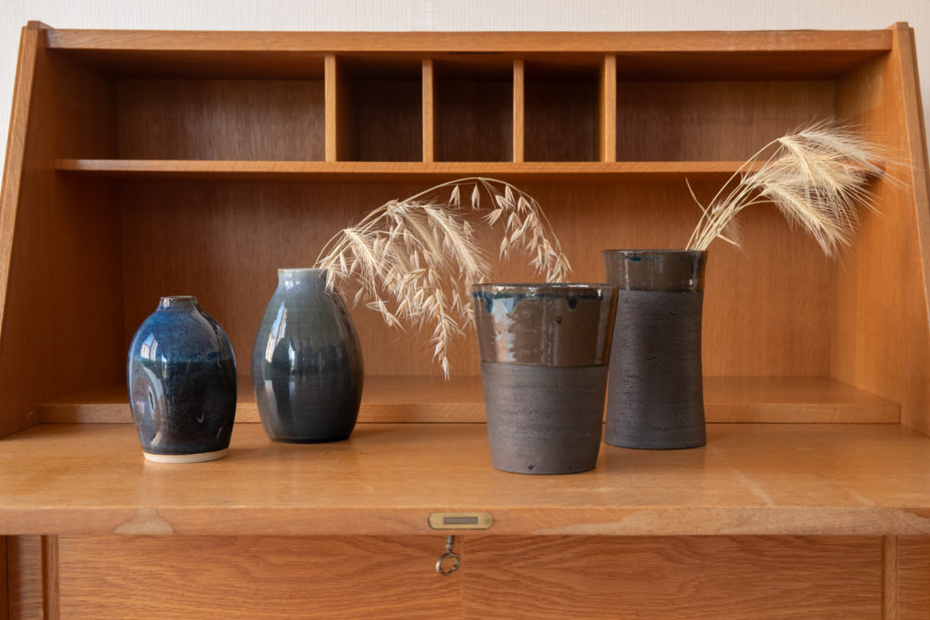 Handcrafted jars in dark colours